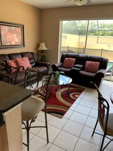 Windsor Hills House | 3 BR 2 Miles to Disney, pool, free WiFi and more townhouse