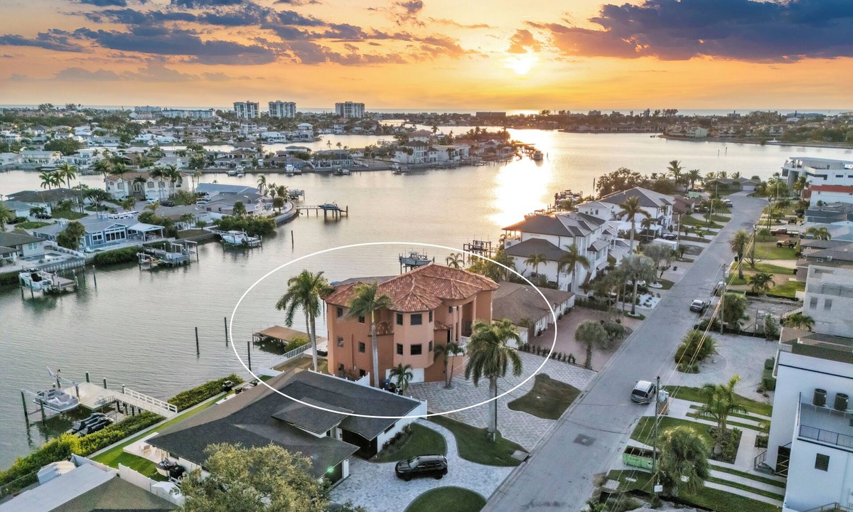 Causeway Isles House | Indulge in luxury at this expansive three-story waterfront retreat.