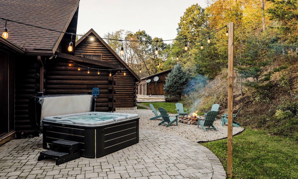 Cedarhurst Cabin | Log Cabin with living room fireplace and hot tub