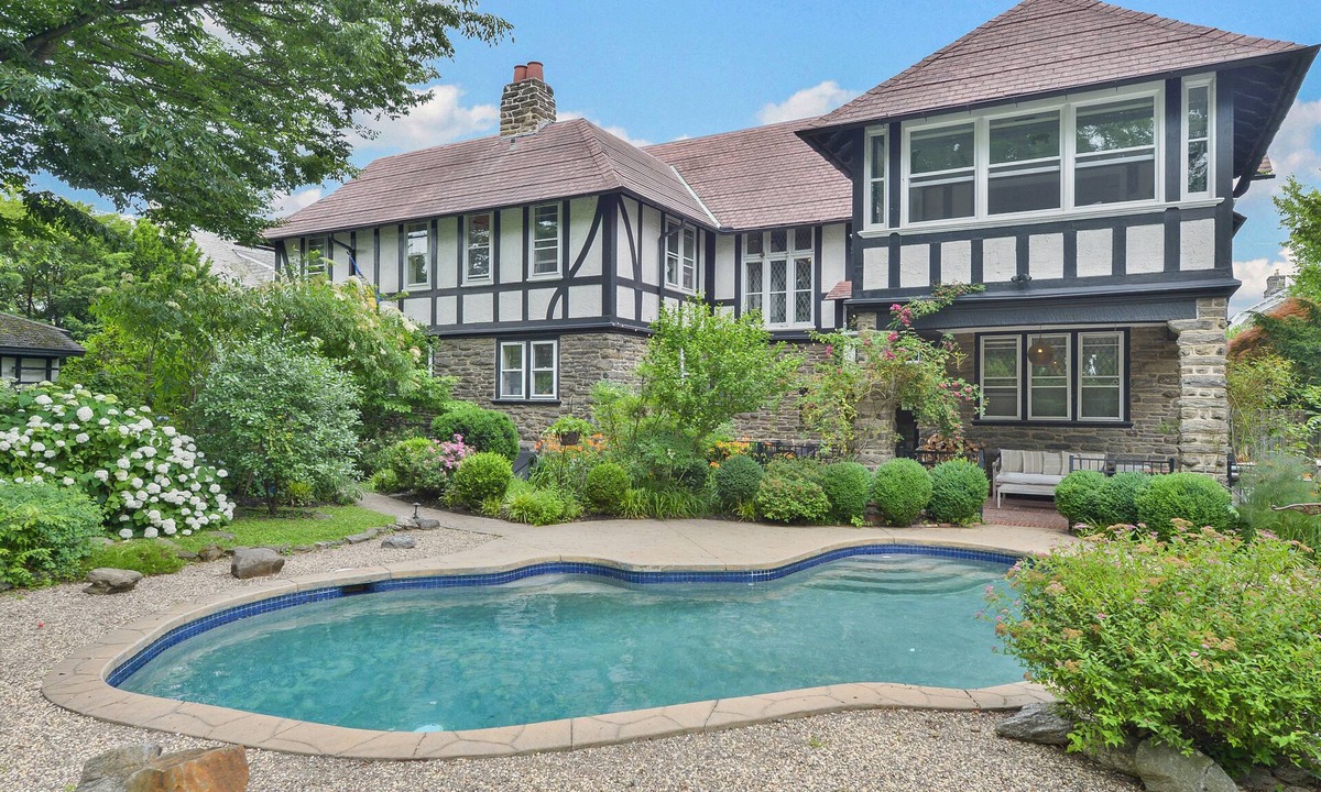 East Mount Airy Villa | Tudor Mansion With Outdoor Oasis and Swimming Pool