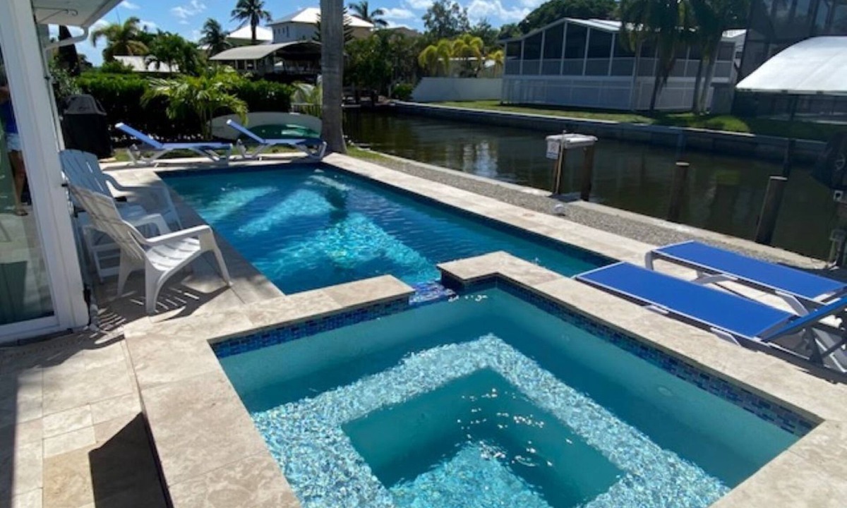 South Island House | WE ARE BACK! NEWER POOL/SPA and Walk to beach! Totally updated Canal front home!