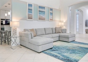 Corner lot home with screened pool + spa, game room, on-site golf, AC, & WiFi