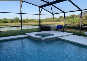 Fabulous lake view 5 bed Villa south facing pool/spa 15 min from Disney & Wifi