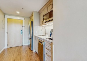 Renovated studio with pool, hot tub, full sized fridge, and 2 burner stovetop