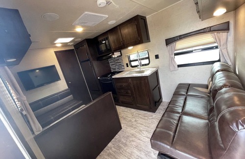 Brampton House | 2019 East to West Della Terra 25 Foot Travel Trailer on a rural property