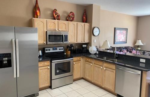 Windsor Hills House | 3 BR 2 Miles to Disney, pool, free WiFi and more townhouse