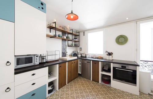 Saint-Vincent-de-Paul Apartment | Balcony Over The Tree-Lined Boulevard, by Veeve