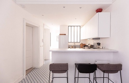 Ternes Apartment | Bright Whites on Pereire Promenade, by Veeve