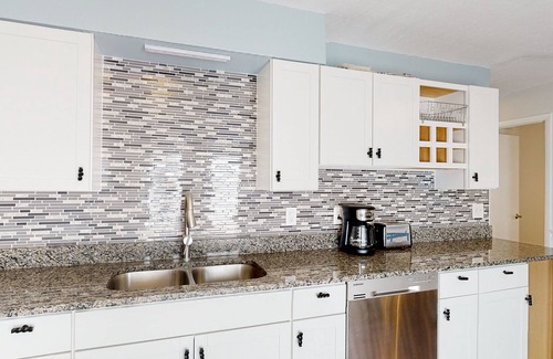 Bayview House | Water view home with five bedrooms, enclosed yard, gas grill, central AC, & W/D