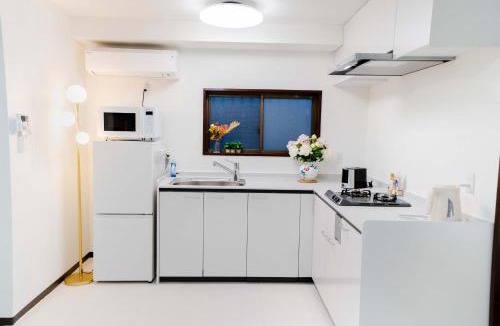 Nishikoiwa Apartment | 102Room,Free parking just a 7-minute walk from Koiwa tram stop This spacious 75-square-meter flats features two large bedrooms and can accommodate up to seven guests