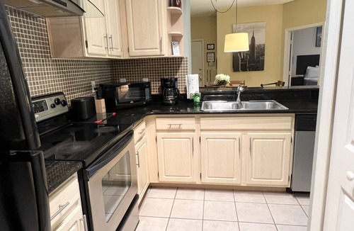 West Kissimmee Condo | 19-104 Two Master Suites, gated resort with heated pool, playground, lakes. gym