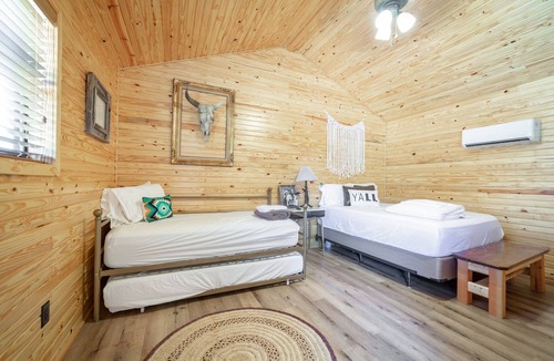 Ramer RV Rental | 1bd rm, 1 bth, hotel style cabin w/Mini fridge, micro, & tv, at Kick Back Ranch