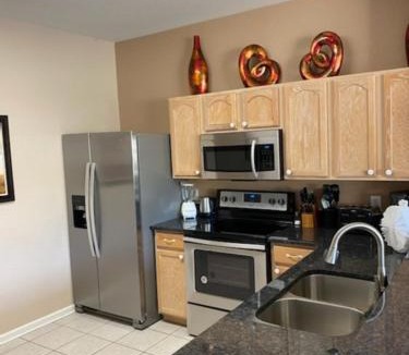 Windsor Hills House | 3 BR 2 Miles to Disney, pool, free WiFi and more townhouse