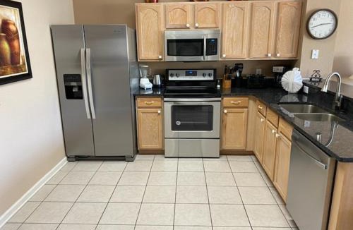 Windsor Hills House | 3 BR 2 Miles to Disney, pool, free WiFi and more townhouse