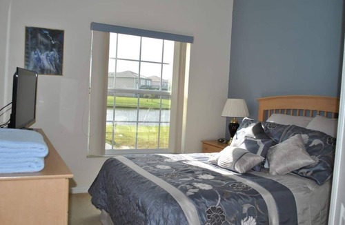 Crescent Lakes House | 6BR Luxury house-South Facing Private Pool, on a lake, hot-tub, BBQ, near Disney