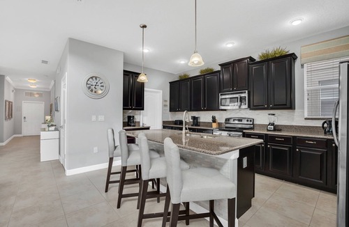 Bay Lake House | 9008 Paradise Palms Blissful Haven: 5-Bed Oasis of Luxury and Tranquility