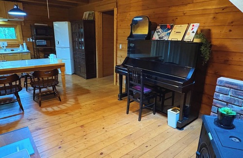 Yawatano House | A log cabin vacation rental nestled on a hill in I/Ito City Shizuoka