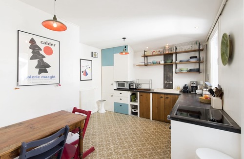 Saint-Vincent-de-Paul Apartment | Balcony Over The Tree-Lined Boulevard, by Veeve