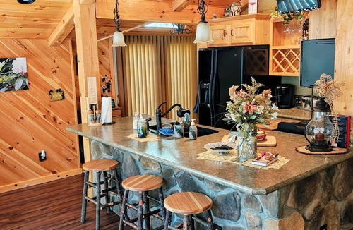 Dayton Cabin | Beautiful 2 BR cabin with a wall of windows overlooking the deck and stream.