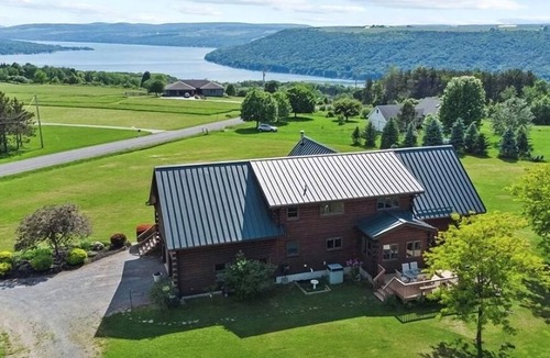 Dundee House | Beautiful lake view home with decks, grill, soaking tub & fireplace