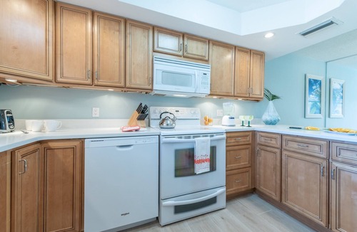 Banana River Estates Condo | Bright Oceanfront Cocoa Beach Condo with Heated Pool & Steps to the Pier!