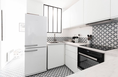 Ternes Apartment | Bright Whites on Pereire Promenade, by Veeve