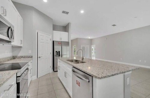 Port Malabar House | Charming 3-bedroom house in Palm Bay with AC, WiFi
