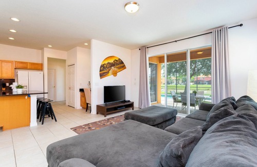 Seasons Villa | Charming 4-bedroom villa with AC, fitness room, WiFi in Kissimmee