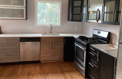 Lido Beach House | Charming canal-front apartment with dock & kayak, walk to restaurants and beach