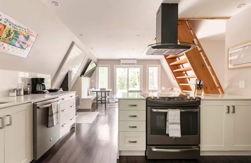 Grey Highlands Cabin | Charming updated A-frame home nestled in the woods adjacent to Kimberley Creek.
