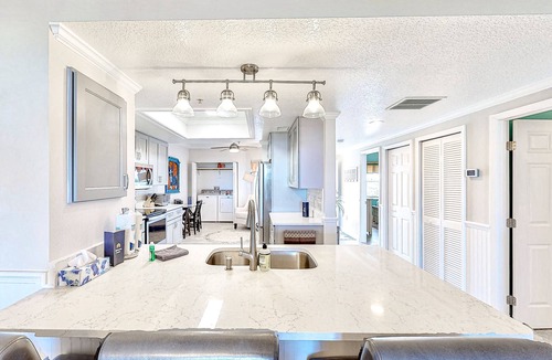 Port Canaveral Condo | Comfy condo in great location with pool, covered balcony, fast WiFi, W/D & AC