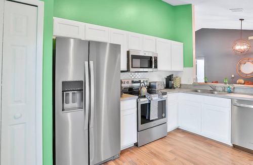 Wellington House | Dog-friendly home with pool, game room, AC, & washer/dryer