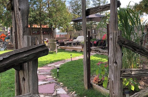 Township of Woolwich Apartment | Doggy heaven. Large fenced yard , beautiful gardens, guest patio and firepit.