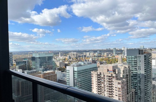 Bay Street Corridor Apartment | Enjoy panoramic city views from this stylish apartment near Dundas Square