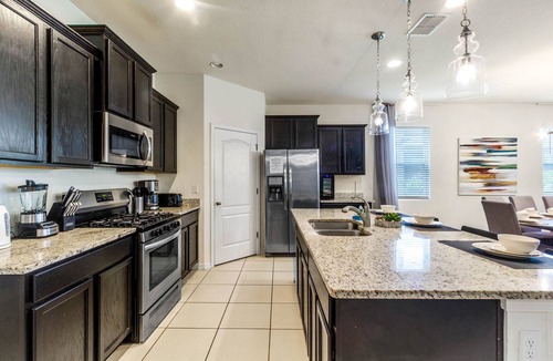 Sunridge Woods Villa | EV 7049 - 6 Bed 4.5 Bath Villa with Screened-In Private Pool with Spillover Spa,