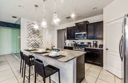 Sunridge Woods Villa | EV 7049 - 6 Bed 4.5 Bath Villa with Screened-In Private Pool with Spillover Spa,