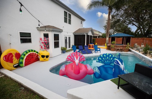 Tropic House | Gorgeous Urban Oasis w/Hot Tub, HEATED POOL and Private Movie Theater by RedAwning