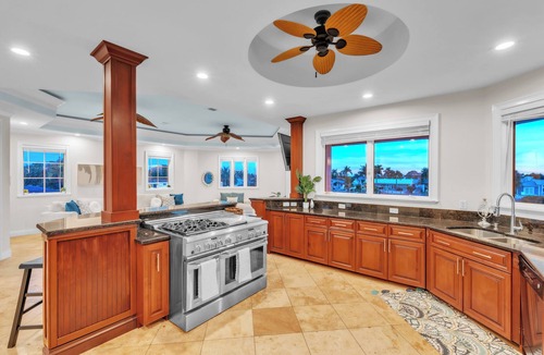 Causeway Isles House | Indulge in luxury at this expansive three-story waterfront retreat.