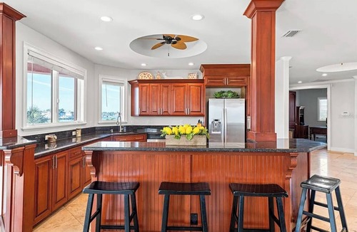 Causeway Isles House | Indulge in luxury at this expansive three-story waterfront retreat.