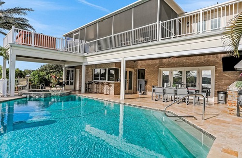 Carrollwood House | Inviting lakefront home with dock, kayaks, hot tub, pool, firepit, & W/D