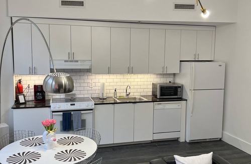 Central Business District Condo | Location! Location! Location! “Happy Chic” 3BR/2BA modern condo near Bourbon!