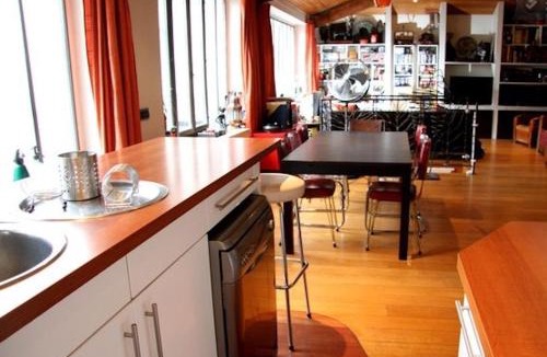 19th Arrondissement Apartment | Loft character with a view of court