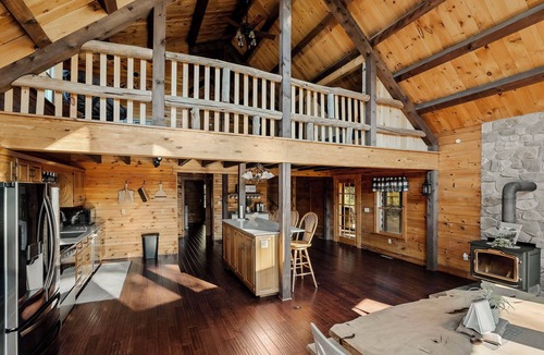 Cedarhurst Cabin | Log Cabin with living room fireplace and hot tub