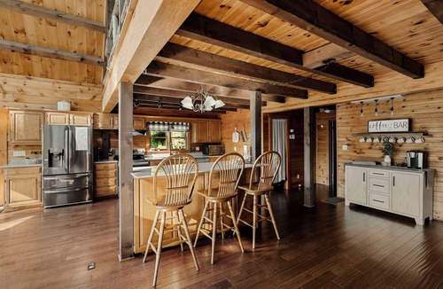 Cedarhurst Cabin | Log Cabin with living room fireplace and hot tub