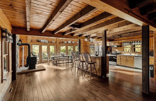 Cedarhurst Cabin | Log Cabin with living room fireplace and hot tub