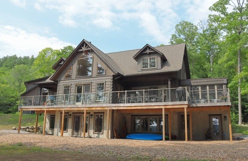 Dysart et al House | Luxurious log cottage with 600-feet of waterfront, 90 Acres.