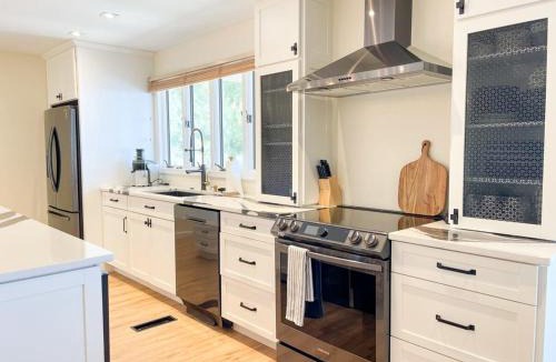 Caine Woods House | Luxury Waterfront Villa Dock Game Room Sunset Views