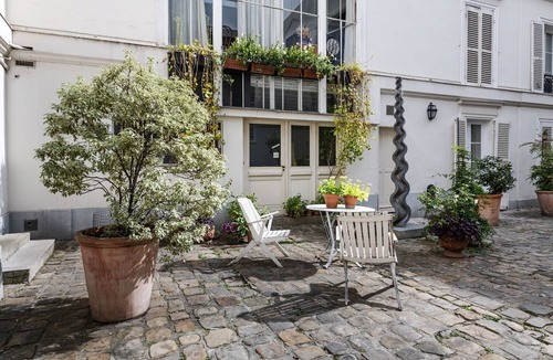 Quartier de Rochechouart Apartment | Modernist Style by the Folies Bergère, by Veeve
