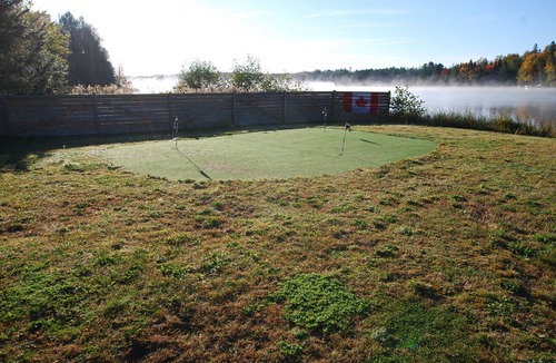 Unorganized Centre Parry Sound Cottage | nCozy waterfront cottage, sandy beach front, sunken hot tub, with putting green.