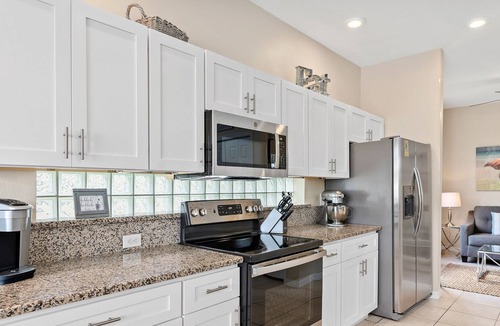 Sunset Lakes Villa | NEW Stunning Lakeview/Gated/Just a few miles to Disney